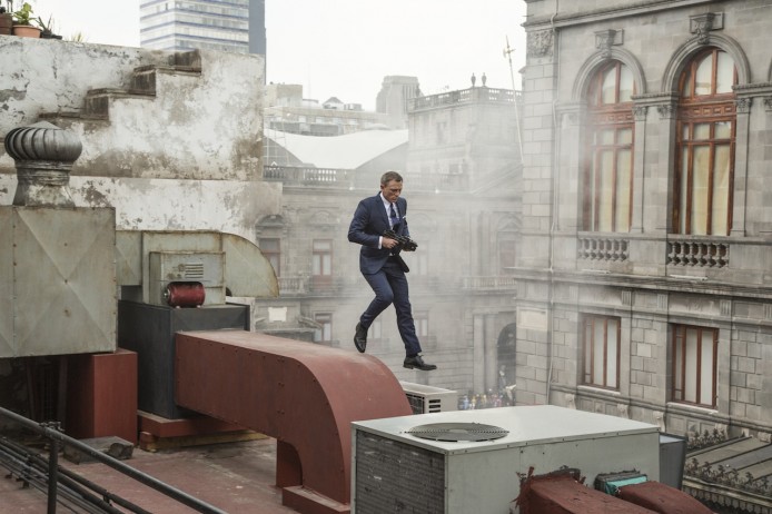 Bond (Daniel Craig) runs along the rooftops in pursuit of Sciarra in Mexico City in Metro-Goldwyn-Mayer Pictures/Columbia Pictures/EON Productions’ action adventure SPECTRE.