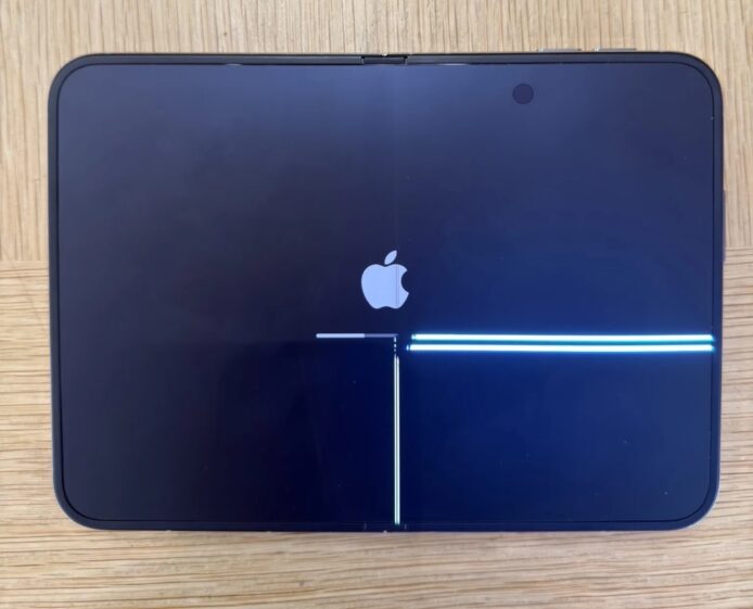 iPhone 螢幕裂痕影像 IPhone 拿起時螢幕出現裂紋與光線反射.